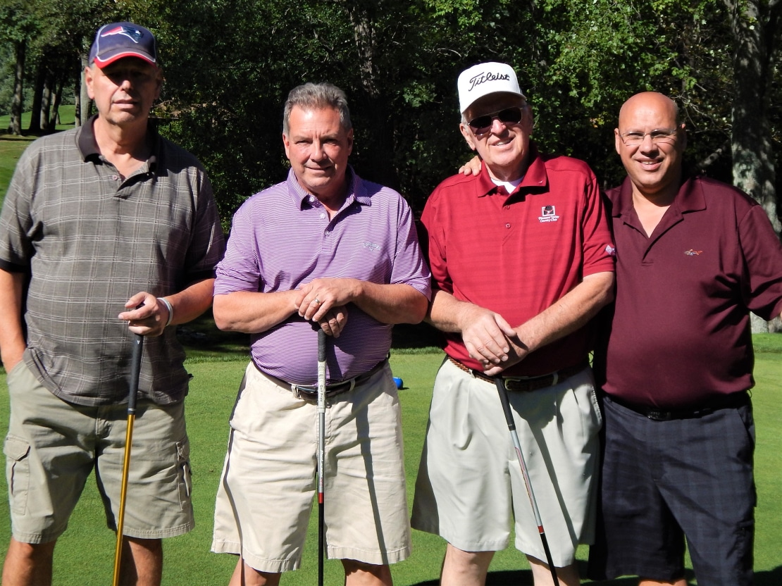 Foursome at 20th Annual Golf Tournament